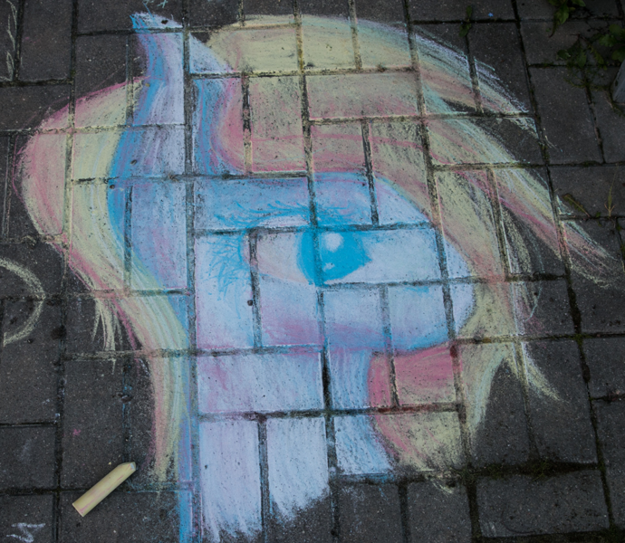 A pony portrait drawn with sidewalk chalk